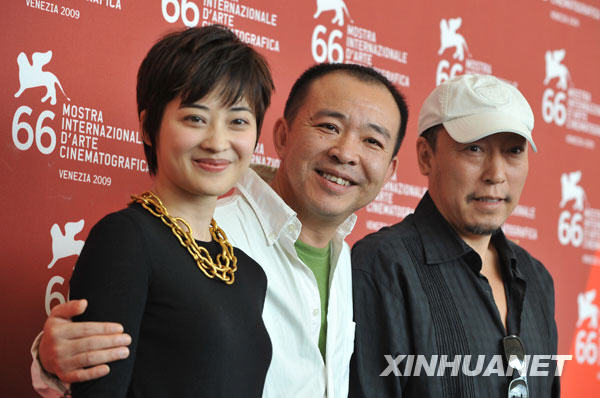 Chinese director Liu Jie(C), actor Ni Dahong(R), and actress Mei Ting are pictured during the presentation of their film 'Touxi (Judge)' during the 66th Venice International Film Festival at Venice Lido, on September 9, 2009.