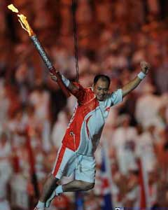 Li Ning ignited the cauldron at the opening ceremony of Beijing Olympic Games after being hoisted high into the air with cables and running around the high portion of the stadium.