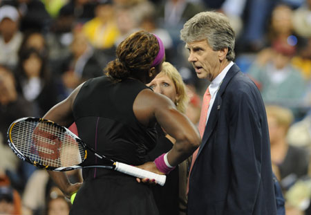Serena Williams (L) of the U.S. talks with tournament referee Brian Earley (C) and an official during her semi-final match against Kim Clijsters of Belgium at the U.S. Open tennis tournament in New York, September 12, 2009. Clijsters won the match 6-4 7-5, which ended in controversy when Williams was called for a foot-fault on a second serve to go match point down. (Xinhua/Shen Hong) 
