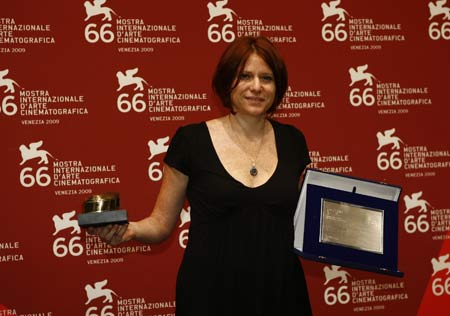 Italian director Susanna Nicchiarelli shows Controcampo Italiano Prize for her film 'Cosmonauta' during the 66th Venice International Film Festival at Venice Lido, Italy,on Sept. 12, 2009.