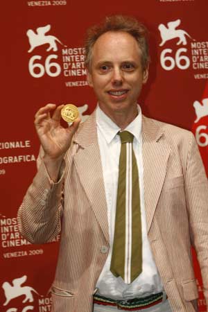 US director Todd Solonz shows the Best Screenplay award for his film 'Life During Wartime' during the 66th Venice International Film Festival at Venice Lido, Italy, on Sept. 12, 2009. 