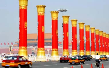 Photo taken on Sept. 14, 2009 shows the array of Columns of Ethnic Groups Unity, on the east side of Tian'anmen Square, in Beijing. A total of 56 Columns of Ethnic Groups Unity, one of the landmark decorations for the grand celebration of the 60th anniversary of the founding of People's Republic of China, start to be installed. Each column stands at a height of 13 meters and weighs 26 tons, depicting the vivid figures of each ethnic group's people in festival attirements who are singing merrily and dancing gracefully.[XinHua]