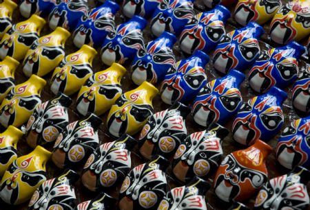 Photo taken on Sept. 12, 2009 shows 'Nigugu', a traditional putty-made toy, at Yangjitun Village of Junxian County, central China's Henan Province. (Xinhua/Chang Zhongzheng)