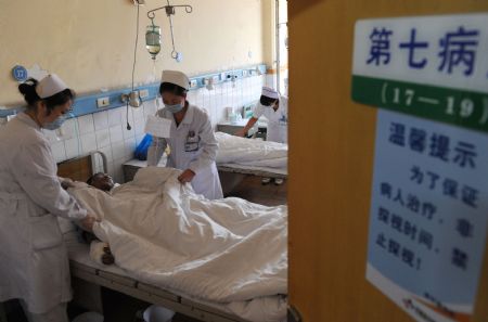 A wounded miner of the Xinhua No. 4 coal mine is treated at a hospital in Pingdingshan City, central China's Henan Province, on Sept. 9, 2009. A total of 93 people were working in the coal mine where a gas explosion happened Tuesday morning, leaving at least 42 dead.(Xinhua/Zhao Peng) 