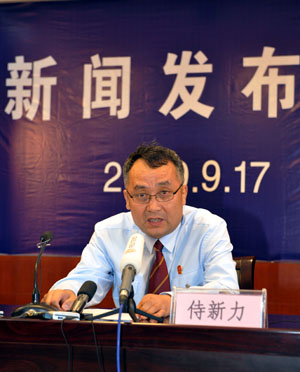 President of the Municipal Intermediate People's Court of Urumqi Shi Xinli speaks at a press conference in Urumqi, capital of northwest China's Xinjiang Uygur Autonomous Region, Sept. 17, 2009. 