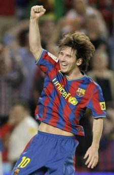 Barcelona's Leo Messi celebrates after scoring his second goal against Atletico Madrid during their Spanish First Division soccer match at Camp Nou stadium in Barcelona Spetember 19, 2009.(Xinhua/Reuters Photo) 