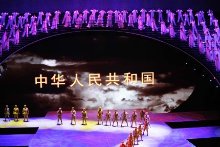 Actors and actresses perform a dance of the musical "Road to Revival" at the Great Hall of the People in Beijing, capital of China, on Sept. 20, 2009.(Xinhua/Chen Shugen)