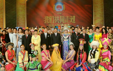 Jia Qinglin (C, 2nd row), chairman of the National Committee of the Chinese People's Political Consultative Conference (CPPCC), poses for a group photo after watching an art performance celebrating the 60th anniversary of the founding of the CPPCC, the country's top political advisory body, in Beijing, China, on Sept. 20, 2009. (Xinhua/Huang Jingwen)