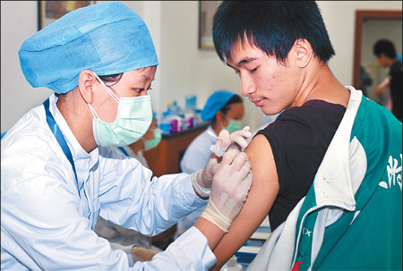 A student from the Central University for Nationalities is among the first to get an H1N1 vaccine jab yesterday.   