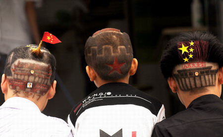 Men display their National Day-themed haircuts in Zhenzhou, capital of central China's Henan province, September 15, 2009, in the run-up to the 60th anniversary of the founding of New China on October 1. [CFP] 