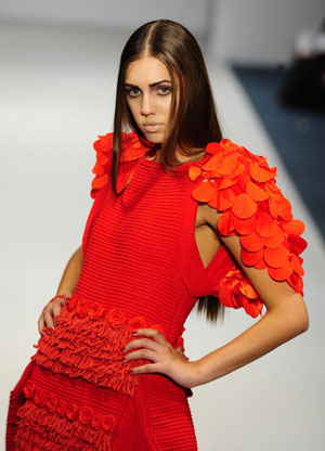 Models display creations of Chinese designer Xie Haiping during a show in London, September 21, 2009. Three designers from Shenzhen, south China, presented their catwalk shows in London on Monday, the fourth day of the London Fashion Week Spring/Summer 2010.