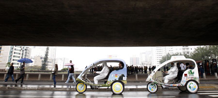 People ride a bike taxi during a protest against cars during World Car Free Day on a road in Sao Paulo September 22, 2009.