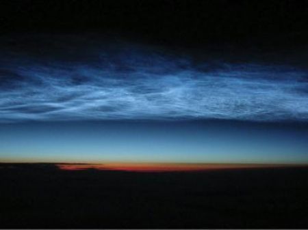 Noctilucent clouds are high atmosphere cloud formations thought to be composed of small ice-coated particles. They form 51miles above sea level. This one was spotted south of Iceland from an aircraft flying at 41,000 feet. (Source: CCTV.com) 