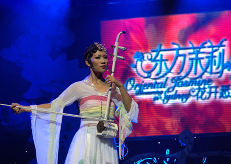 A musician from "Oriental Jasmine", a Chinese traditional instruments orchestra, performs at the Sydney Opera, Australia, Sept. 24, 2009. The "Oriental Jasmine" from southwest China