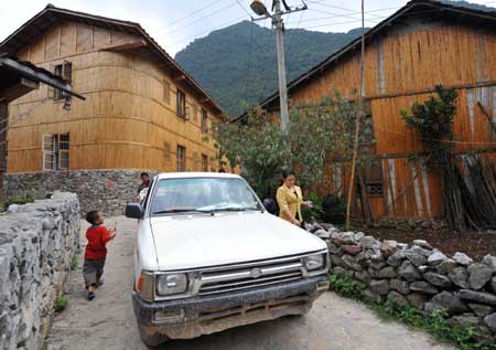 A car owned by a family of Dark Cloth Zhuang is seen in Napo county, southwest China's Guangxi Zhuang Autonomous Region, Sept. 23, 2009. 