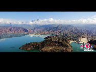 These undated photos shows the turtle-shaped mountains and a lake at the Kanbula National Forest Park in Jianzha County, Huangnan Tibetan Autonomous Prefecture, northwest China's Qinghai Province. Situated about 131km away from Xining, the Kanbula National Forest Park faces the Yellow River and is close to Lijiaxia Hydropower Station. [Photo by Shala]