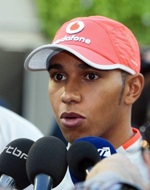 McLaren Formula One driver Lewis Hamilton speaks to the press in the paddock ahead of Sunday's Singapore F1 Grand Prix at the Marina Bay street circuit September 24, 2009.