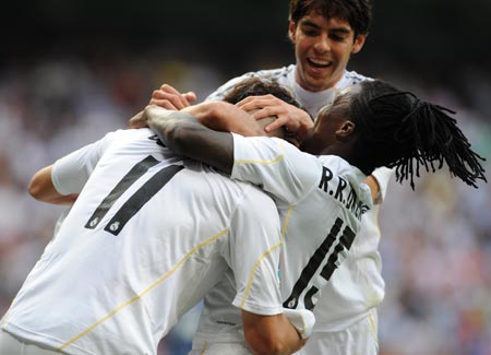 Players from Real Madrid celebrate a goal during their game against Tenerife at home in the Spanish Primera Liga on Sept. 26, 2009. Real Madrid beat Tenerife 3-0. (Xinhua/Chen Haitong)