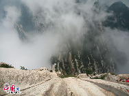 Mount Hua is located in the Shaanxi Province, about 100 kilometres east of the city of Xi'an, near the city Huayin. Hua was historically the location of several influential Taoist temples, and was known as a centre for the practice of traditional Chinese martial arts.[Photo by Li Wenke]