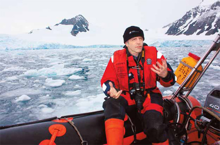 David Vaughan, a leading glaciologist with the British Antarctic Survey, looks out through rain at the Sheldon glacier on the Antarctic Peninsula in this January 2009 file photo. 