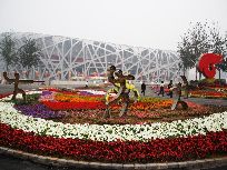 A huge parterre is seen in front of the National Stadium or 'Bird's Nest' in Beijing, capital of China. The Olympic Park in which the Bird's Nest is located has been decorated to celebrate the 60th anniversary of the founding of the People's Republic of China which falls on Oct. 1.[Photo by Hu Junfeng]