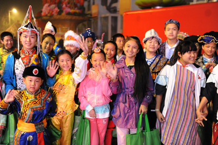 Children performers of the National Day celebrations gather at the Workers Stadium in the early morning in Beijing, on Oct. 1, 2009. China will celebrate on Oct. 1 the 60th anniversary of the founding of the People's Republic of China. 