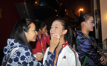 Performers get ready to board the floats at the Workers Stadium in the early morning in Beijing, on Oct. 1, 2009. China will celebrate on Oct. 1 the 60th anniversary of the founding of the People's Republic of China.