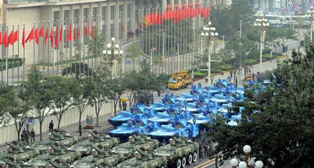 Vehicles are seen ahead of the parade of the celebrations for the 60th anniversary of the founding of the People's Republic of China in Beijing, Oct. 1, 2009.