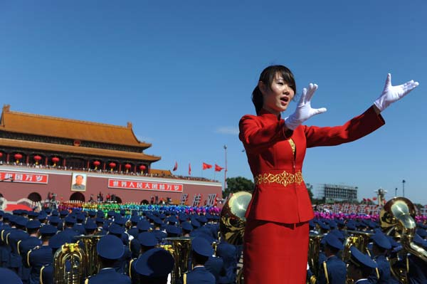 The conductor of a chorus conducts in the celebrations for the 60th anniversary of the founding of the People's Republic of China, on the Tian'anmen Square in central Beijing, capital of China, Oct. 1, 2009.