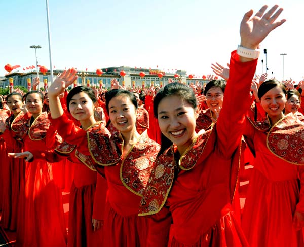 Members of a chorus gesture in the celebrations for the 60th anniversary of the founding of the People's Republic of China, on the Tian'anmen Square in central Beijing, capital of China, Oct. 1, 2009.