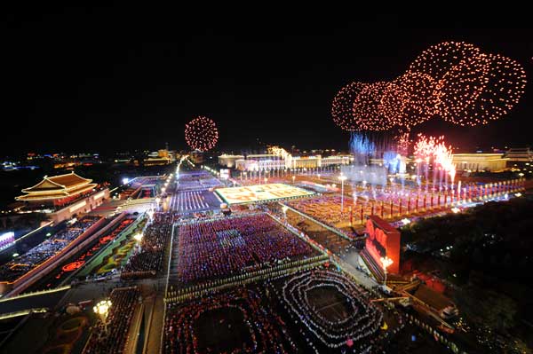 A grand evening gala is held to celebrate New China's 60th anniversary on Oct. 1 evening at the Tian'anmen Square in Beijing. Red, pink, white and orange fireworks shot up into the night sky, lighting up the Tian'anmen Rostrum. 