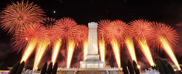 A grand evening gala is held to celebrate New China's 60th anniversary on Oct. 1 evening at the Tian'anmen Square in Beijing. Red, pink, white and orange fireworks shot up into the night sky, lighting up the Tian'anmen Rostrum. 