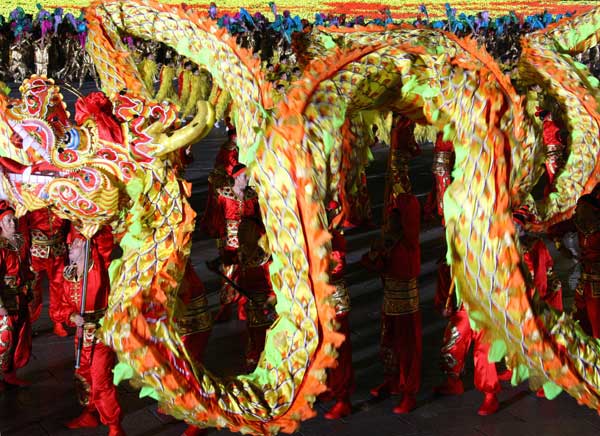 A grand evening gala is held to celebrate the People's Republic of China's 60th anniversary at the Tian'anmen Square in Beijing on Oct. 1 evening. Fireworks light up the TiDancers perform at the show. 