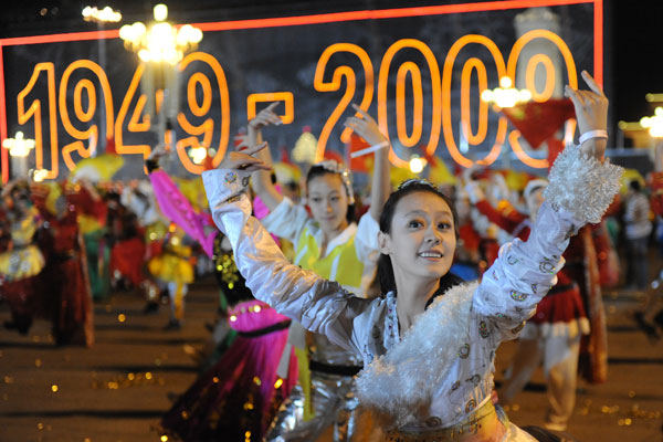 A grand evening gala is held to celebrate the People's Republic of China's 60th anniversary at the Tian'anmen Square in Beijing on Oct. 1 evening. Fireworks light up the TiDancers perform at the show.