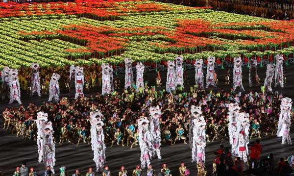 A grand evening gala is held to celebrate the People's Republic of China's 60th anniversary at the Tian'anmen Square in Beijing on Oct. 1 evening. Fireworks light up the TiDancers perform at the show. 