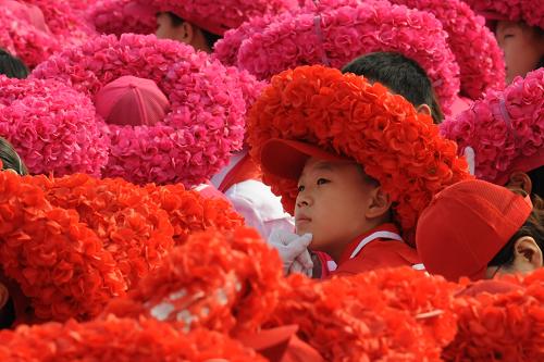 People participating in the ceremony are making the final preparation for the celebration to be started at 10:00 AM. 