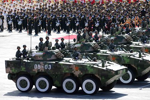 Wheeled armored vehicles rolls into Tian'anmen Square for inspection.