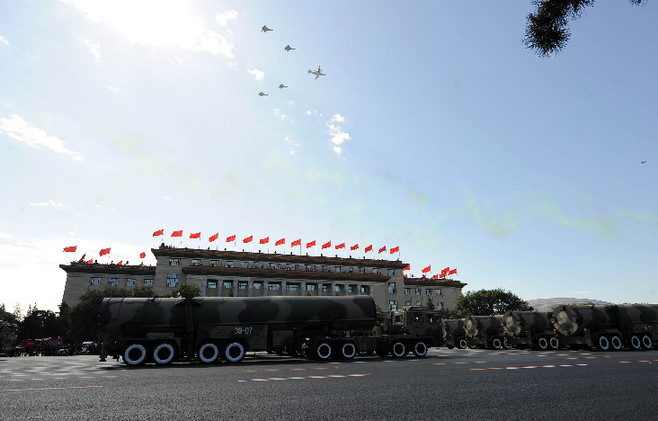 Strategic nuclear ICBM formation passes through the Tian'anmen Square during the Grand Military Parade, meeting Air Force jets. 