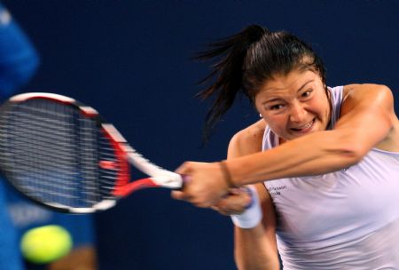 World number one Dinara Safina of Russia returns a shot to Zhang Shuai of China during the second round match of women's singles at China Open 2009 in Beijing, capital of China, Oct. 5, 2009. Safina lost 0-2.