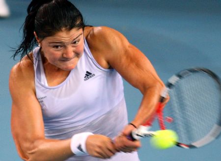 World number one Dinara Safina of Russia returns a shot to Zhang Shuai of China during the second round match of women's singles at China Open 2009 in Beijing, capital of China, Oct. 5, 2009. Safina lost 0-2.