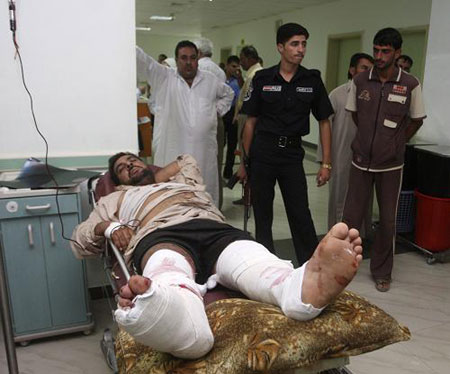 At least nine people were killed and 31 others injured in a car bomb explosion at a busy marketplace in Iraq's western city of Fallujah on Tuesday, Oct. 6, 2009. (Xinhua/Reuters Photo)