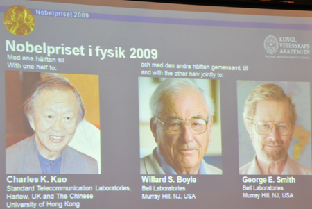 Photos of three winners of the Nobel Prize in physics for 2009 are seen on a screen during an announcement ceremony in Stockholm, Sweden, Oct. 6, 2009. Charles K. Kao, Willard S. Boyle and George E. Smith on Tuesday won the 2009 Nobel Prize in Physics for discoveries of importance for the internet and data and telephone communications and the digital camera. (Xinhua/Wu Ping) 