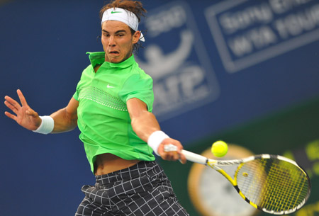 Rafael Nadal of Spain returns the ball during the men's singles second round match against James Blake of the U.S. at the China Open tennis tournament in Beijing, Oct. 8, 2009. Nadal won 2-1. (Xinhua/Luo Xiaoguang) 