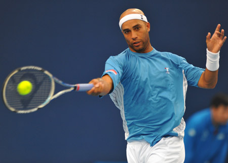 James Blake of the U.S. returns the ball during the men's singles second round match against Rafael Nadal of Spain at the China Open tennis tournament in Beijing, Oct. 8, 2009. Blake lost 1-2. (Xinhua/Luo Xiaoguang)