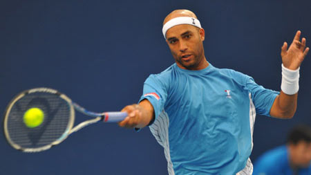 James Blake of the U.S. returns the ball during the men's singles second round match against Rafael Nadal of Spain at the China Open tennis tournament in Beijing.