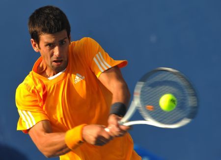 Novak Djokovic of Serbia returns the ball during the men's singles quarterfinal match against Fernando Verdasco of Spain at the China Open tennis tournament in Beijing, Oct. 9, 2009. Djokovic won the match 2-1.[Luo Xiaoguang/Xinhua]