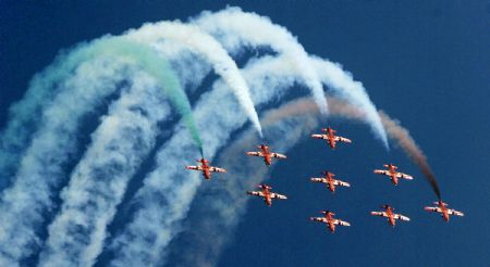 Surya Kiran Light Combat Aircrafts of Indian Air Force perform during the Indian Air Force Day celebration on the outskirts of New Delhi, capital of India, Oct. 8, 2009. The Indian Air Force celebrated its 77th Anniversary on Thursday. [Partha Sarkar/Xinhua]