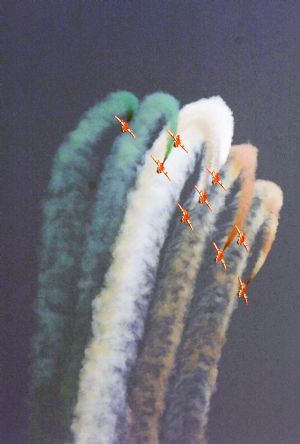 Surya Kiran Light Combat Aircrafts of Indian Air Force perform during the Indian Air Force Day celebration on the outskirts of New Delhi, capital of India, Oct. 8, 2009. The Indian Air Force celebrated its 77th Anniversary on Thursday. [Partha Sarkar/Xinhua]