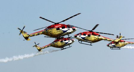 Helicopters of Indian Air Force perform during the Indian Air Force Day celebration on the outskirts of New Delhi, capital of India, Oct. 8, 2009. The Indian Air Force celebrated its 77th Anniversary on Thursday. [Partha Sarkar/Xinhua]