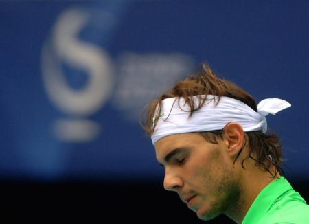 Rafael Nadal of Spain reacts during the men's singles semifinal match against Marin Cilic of Croatia at the China Open tennis tournament in Beijing, Oct. 10, 2009. Nadal lost the match 0-2.(Xinhua/Gong Lei)